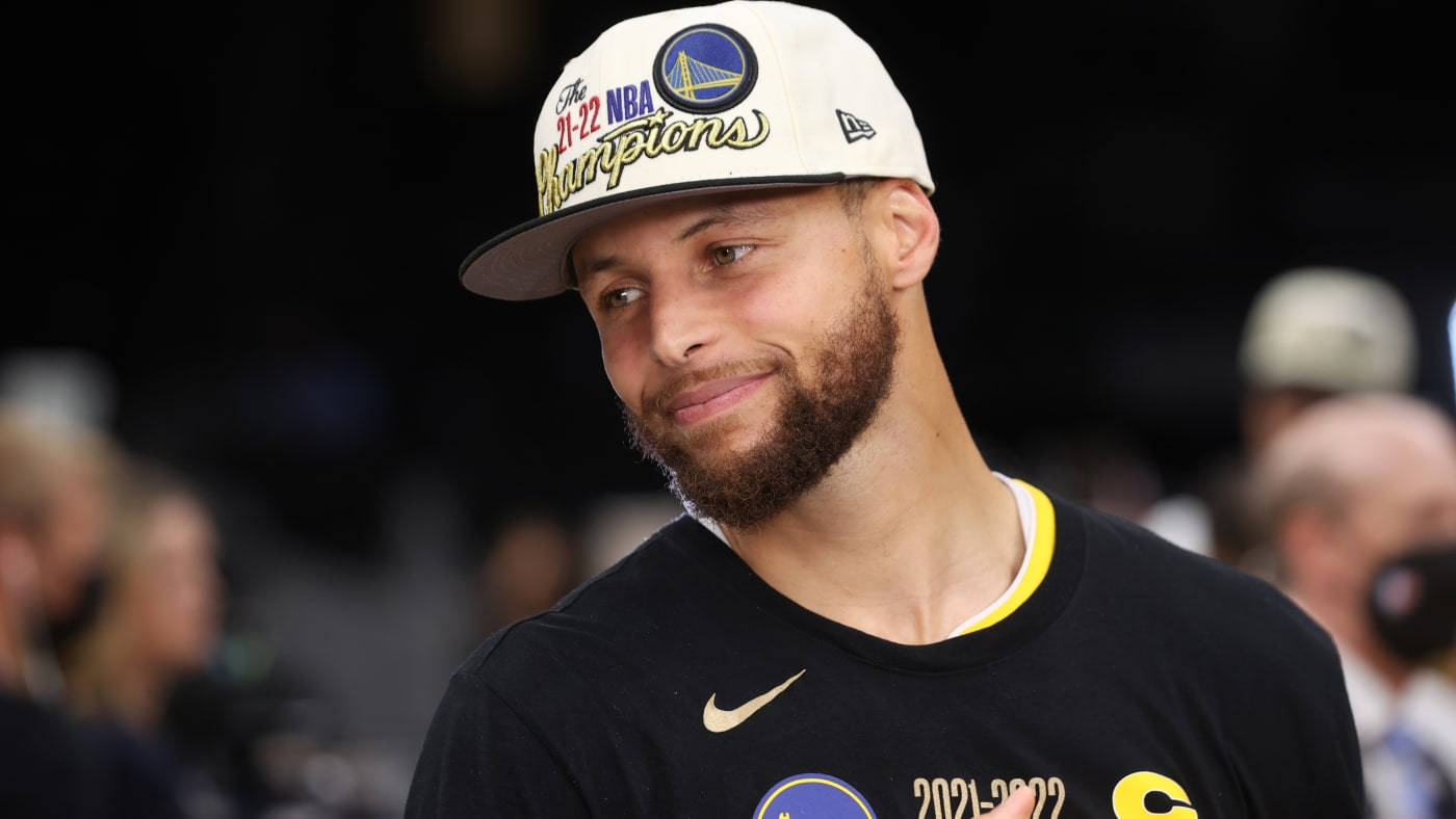 Steph Curry With Warriors Cap Background