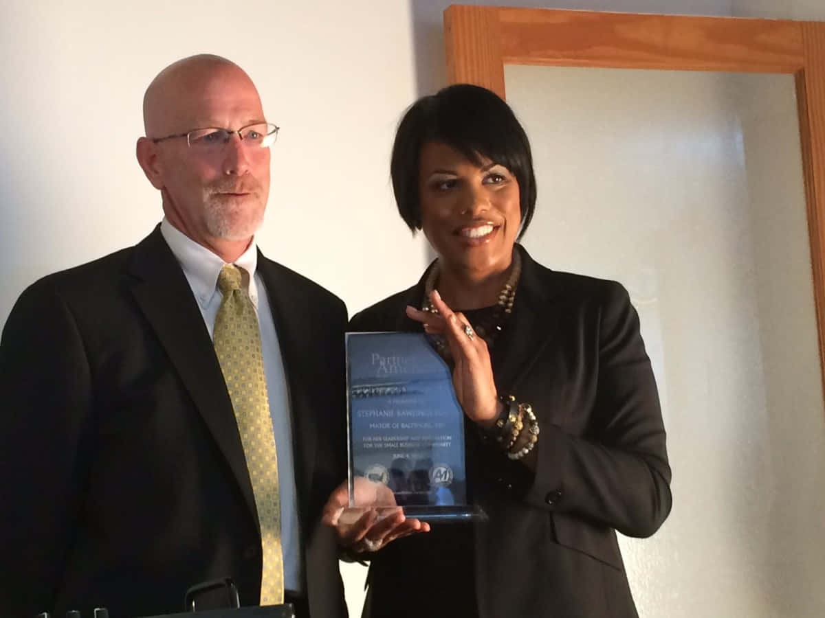 Stephanie Rawlings Blake Holding Trophy Background