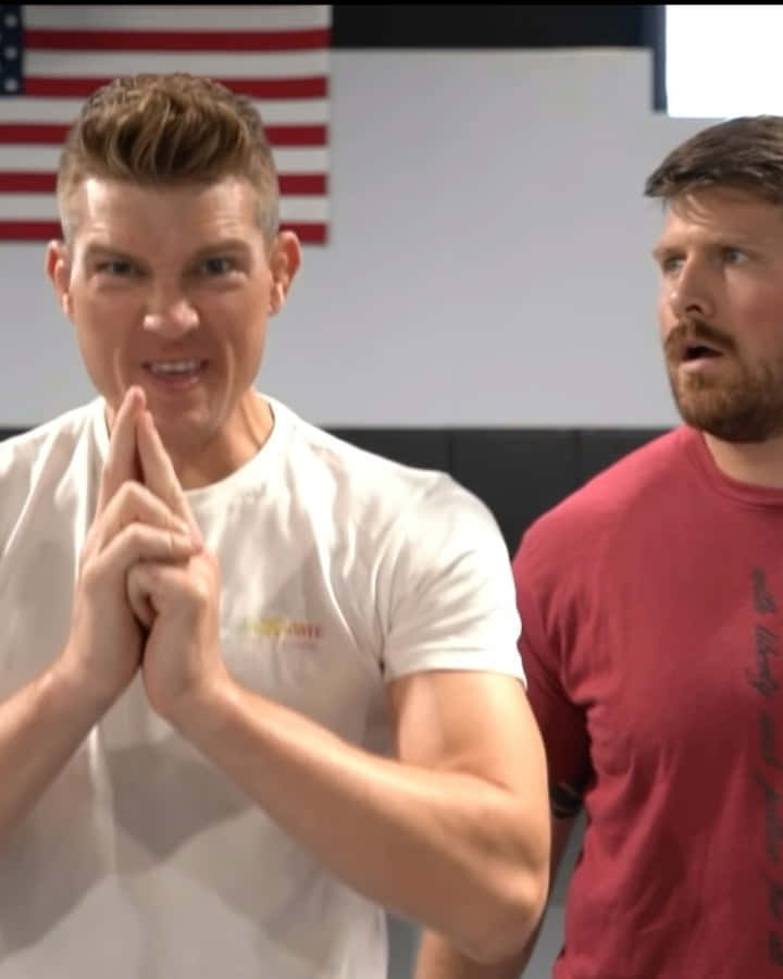 Stephen Thompson Delivering A Dynamic Kick During A Match