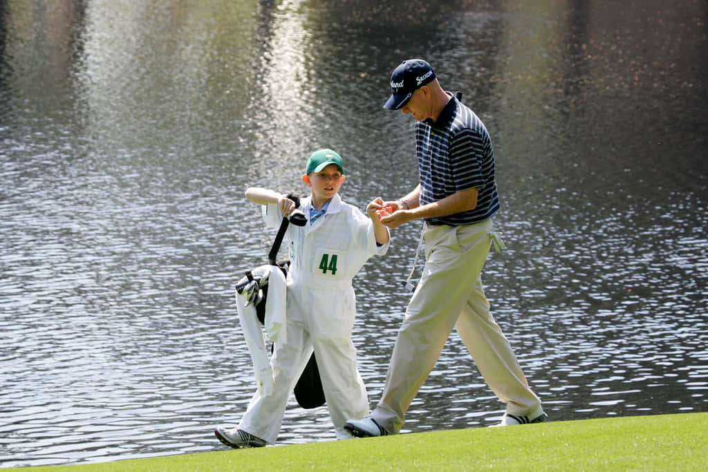 Steve Flesch Guiding A Young Golfer Background