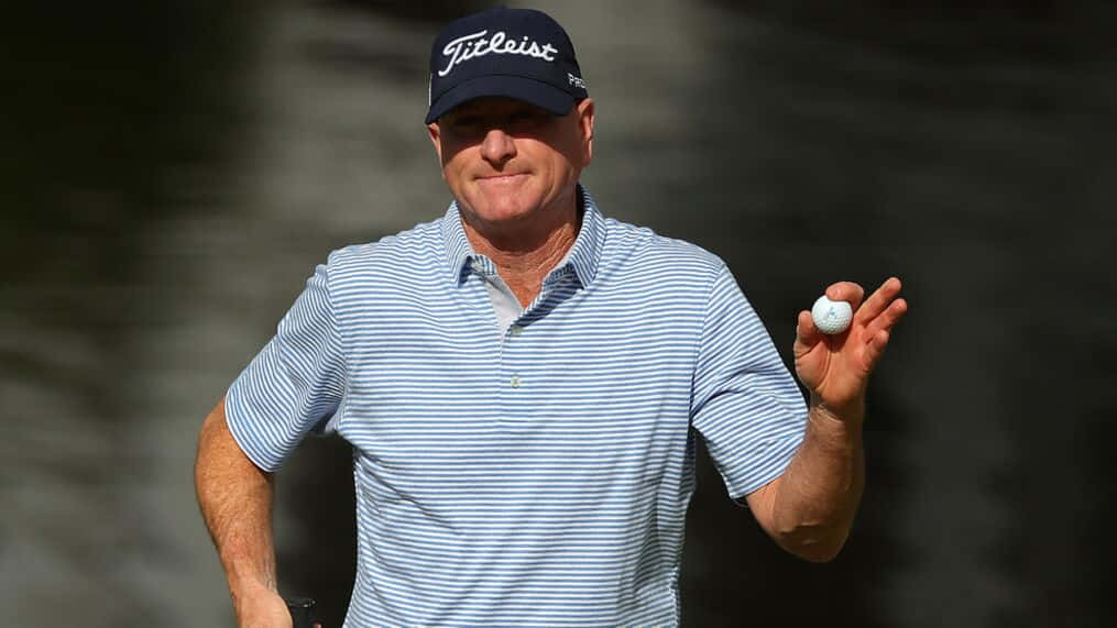 Steve Flesch Holding A Ball Background