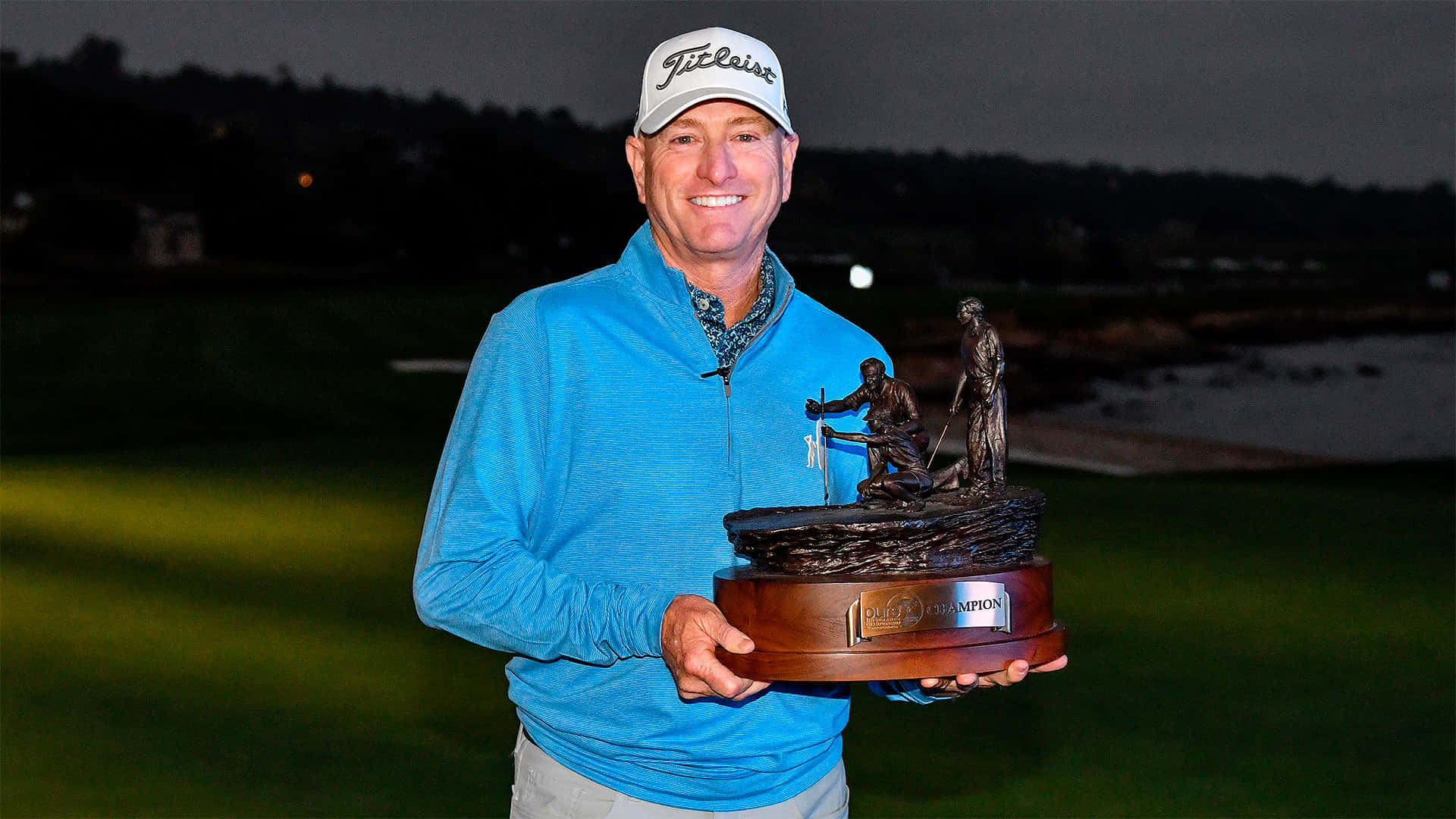 Steve Flesch Holding Sculpted Trophy Background