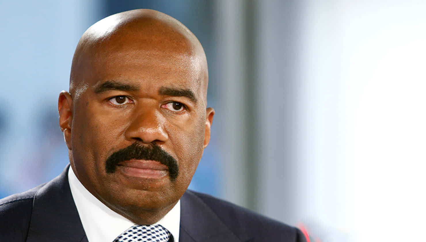 Steve Harvey Looking Towards The Right Background