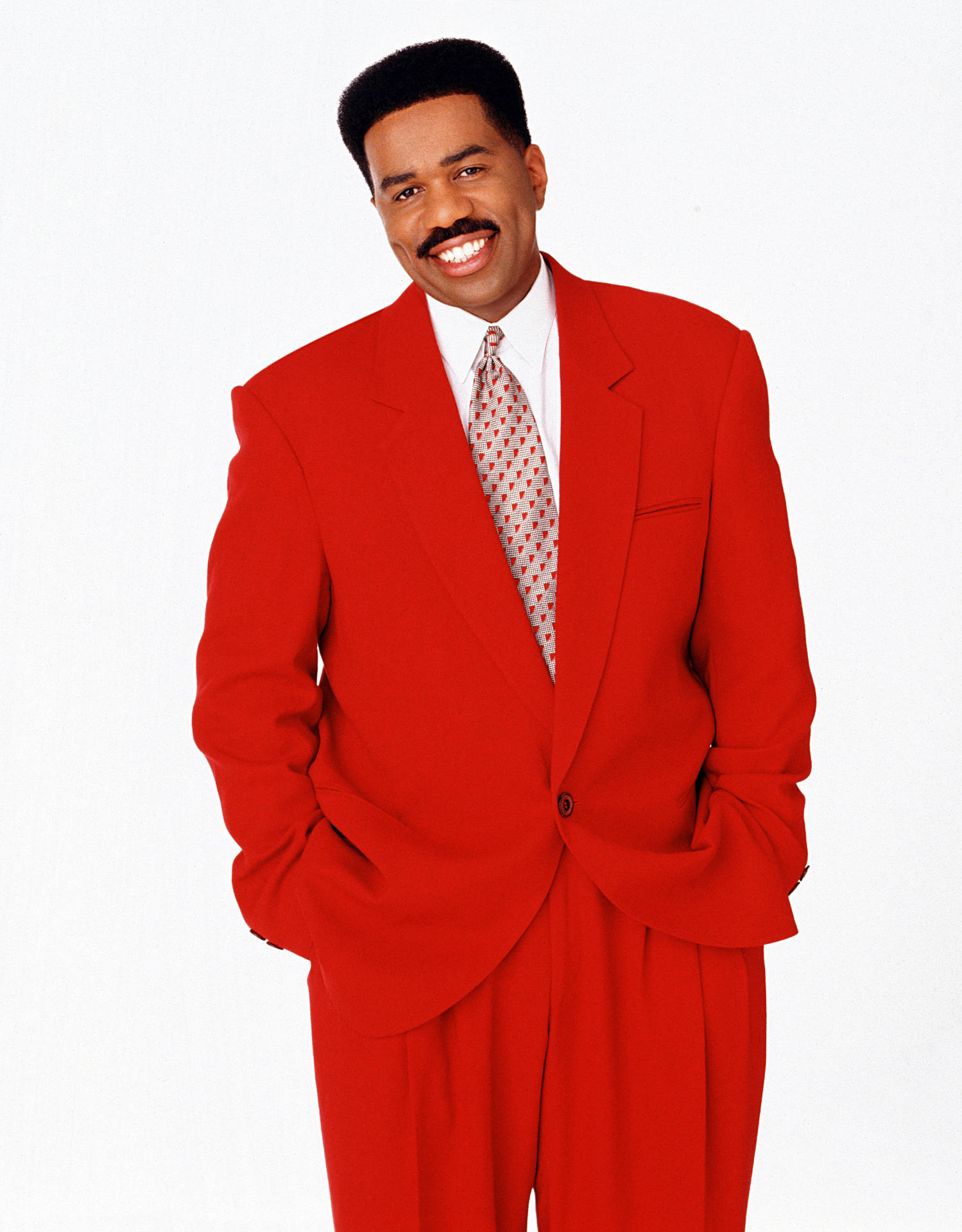 Steve Harvey Smiling In A Red Suit