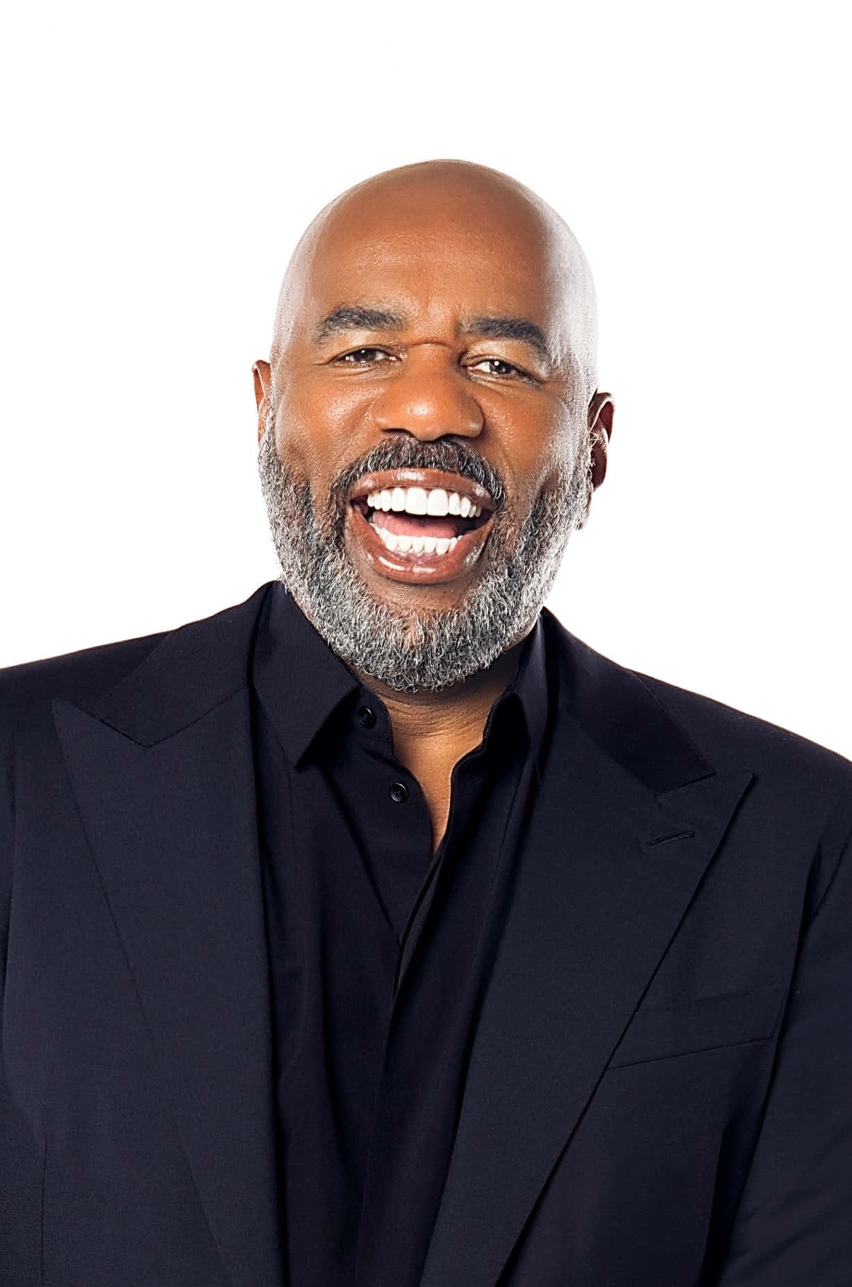 Steve Harvey Smiling With A Beard Background