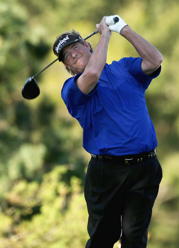 Steve Lowery In A Blue Shirt Background