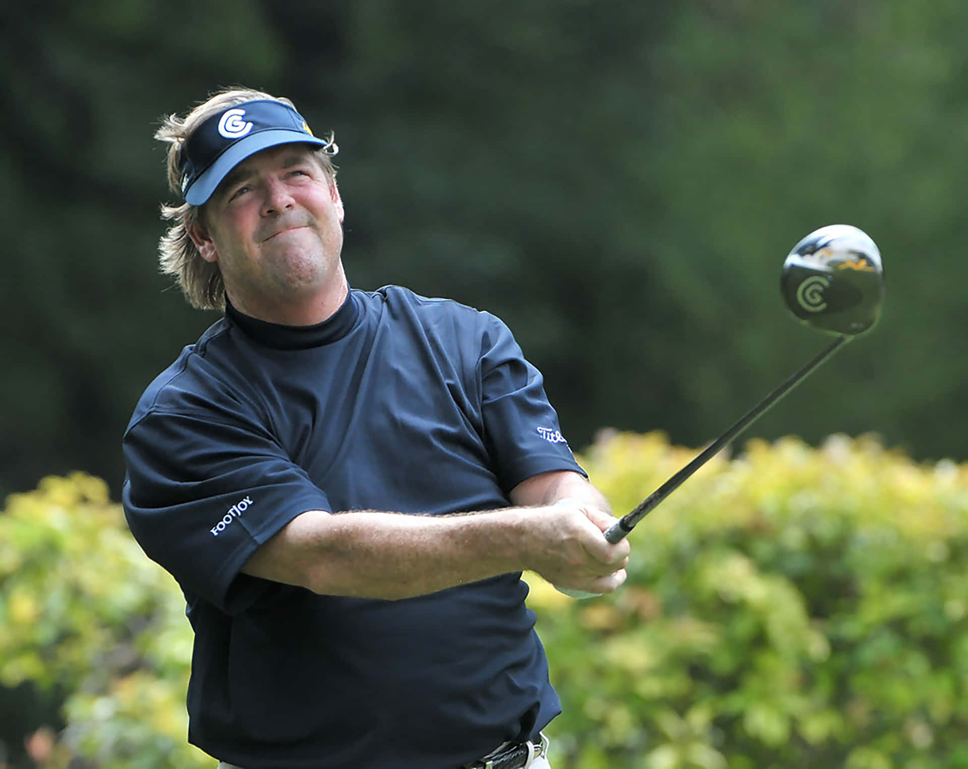 Steve Lowery Looking Up At Golf Ball Background