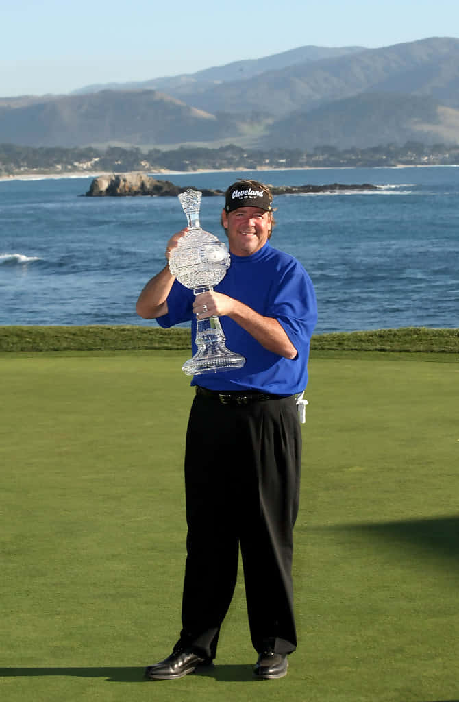 Steve Lowery Posing With Trophy Background
