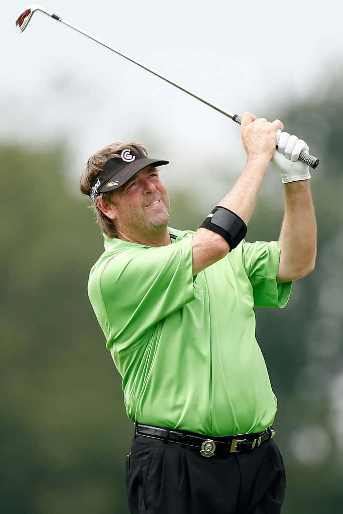 Steve Lowery Watching Golf Shot Background