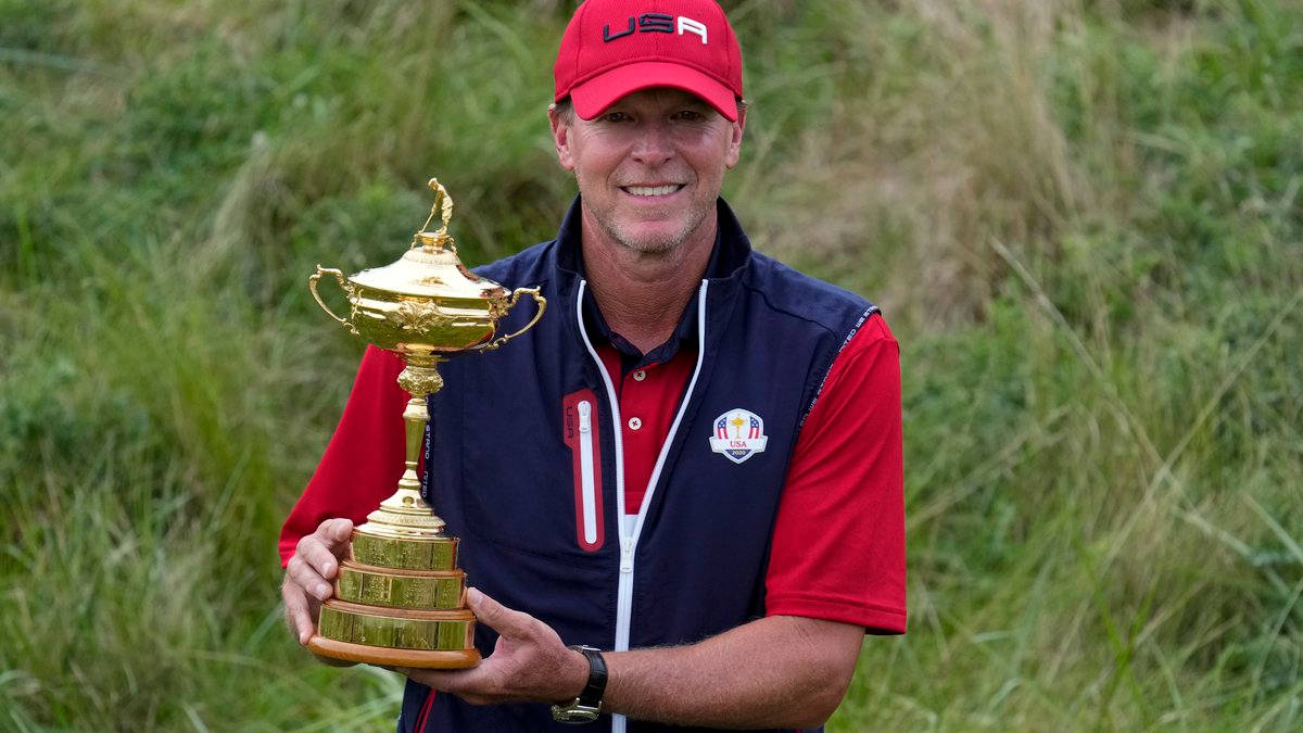 Steve Stricker Holding Gold Trophy Background