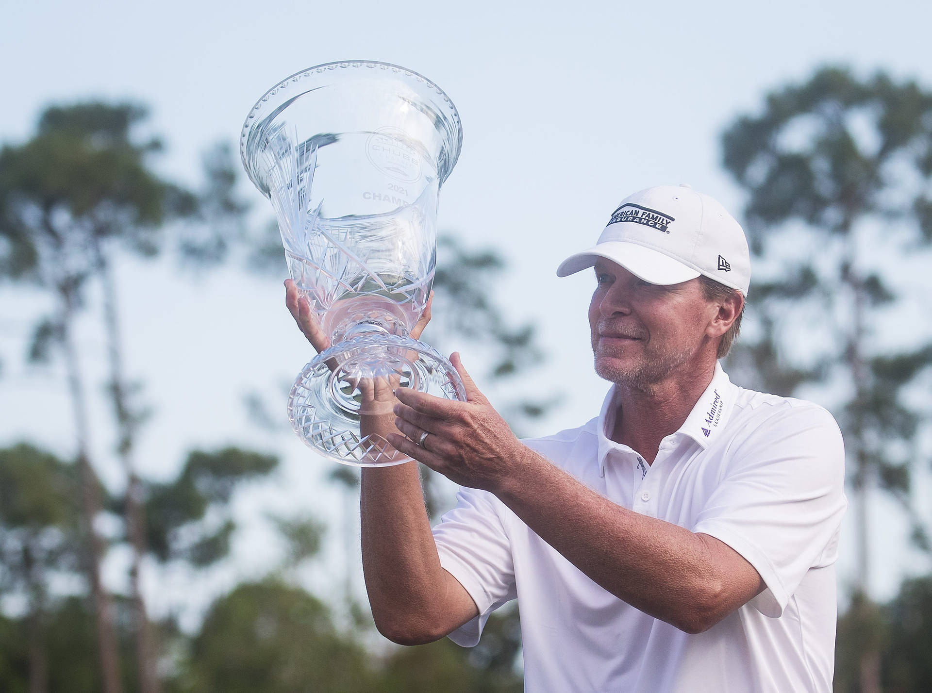 Steve Stricker Raising A Glass Trophy Background