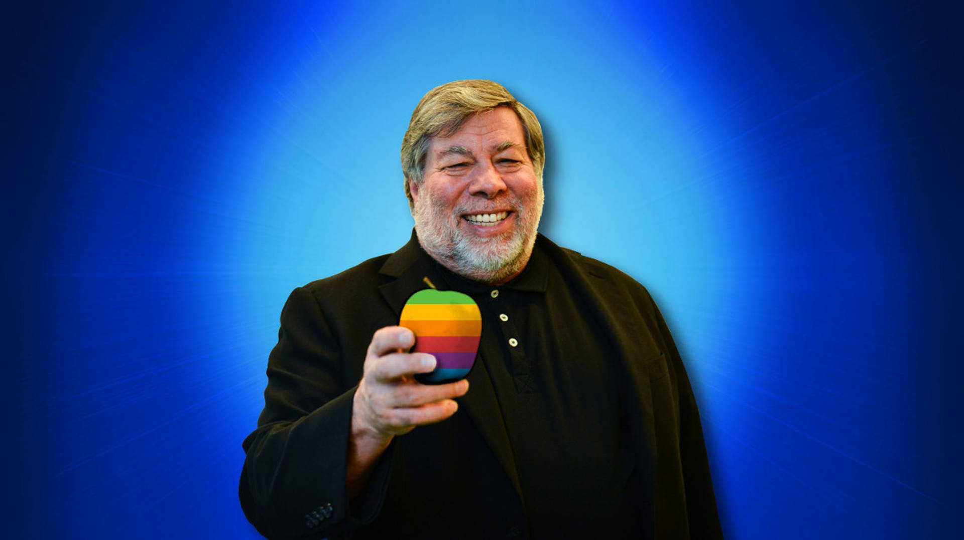 Steve Wozniak Holding An Iconic Colored Apple Logo. Background