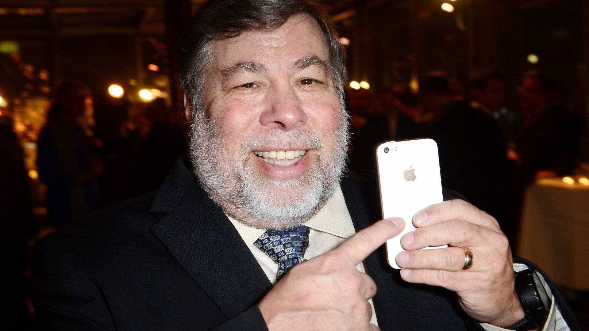 Steve Wozniak Holding An Iphone Background