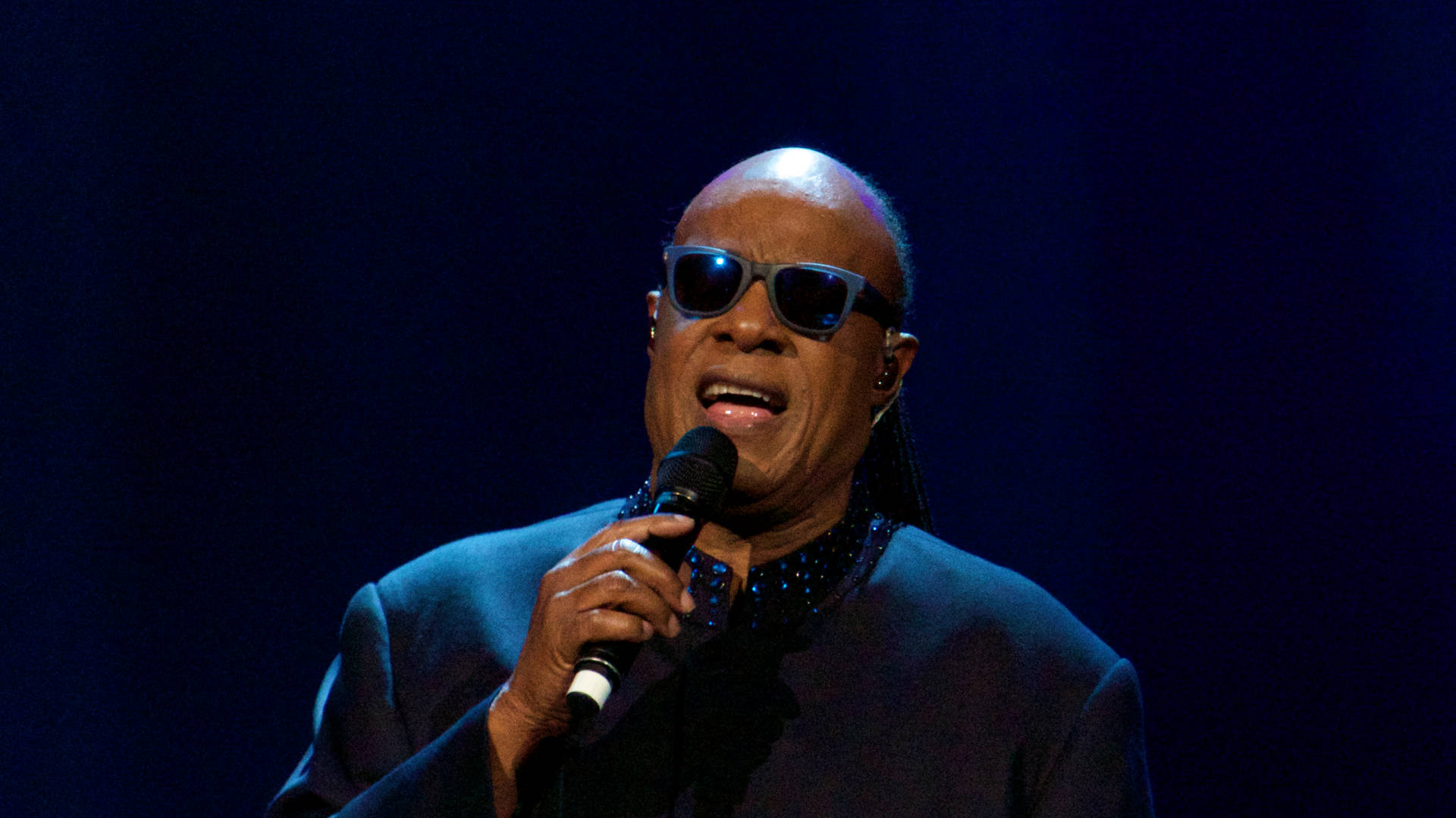 Stevie Wonder Dark Stage Background