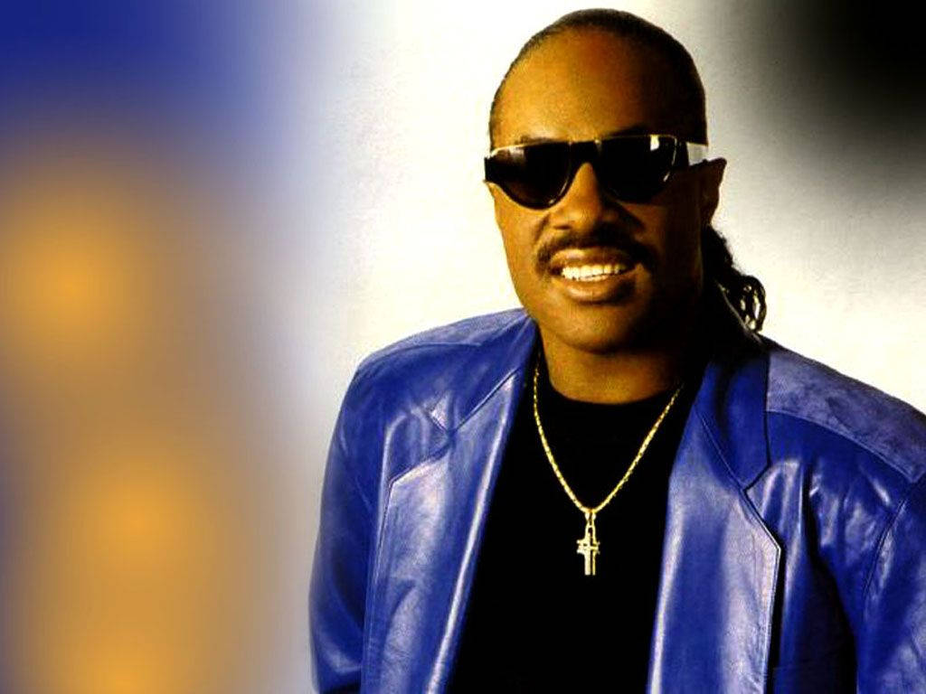 Stevie Wonder In Blue Jacket Background