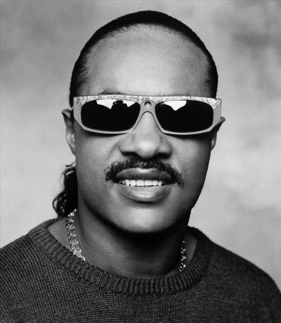 Stevie Wonder Sweetly Smiling Background