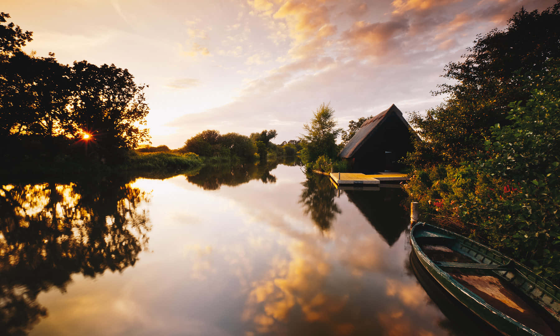 Still Waters Of The Lake In Norfolk Broads Background