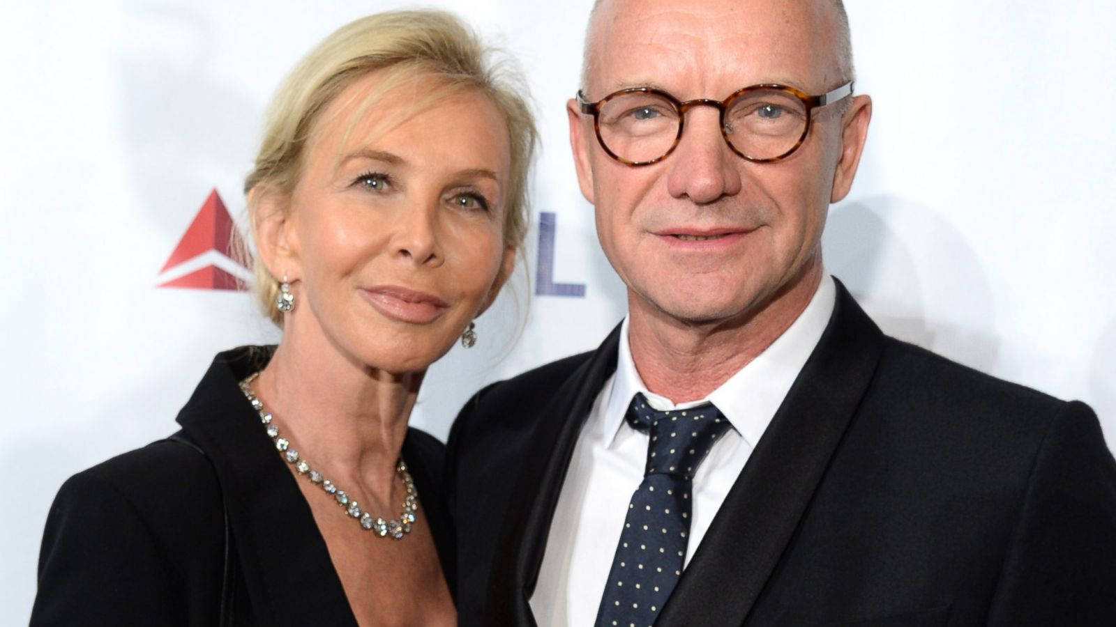 Sting Smiling With Trudie Styler Background