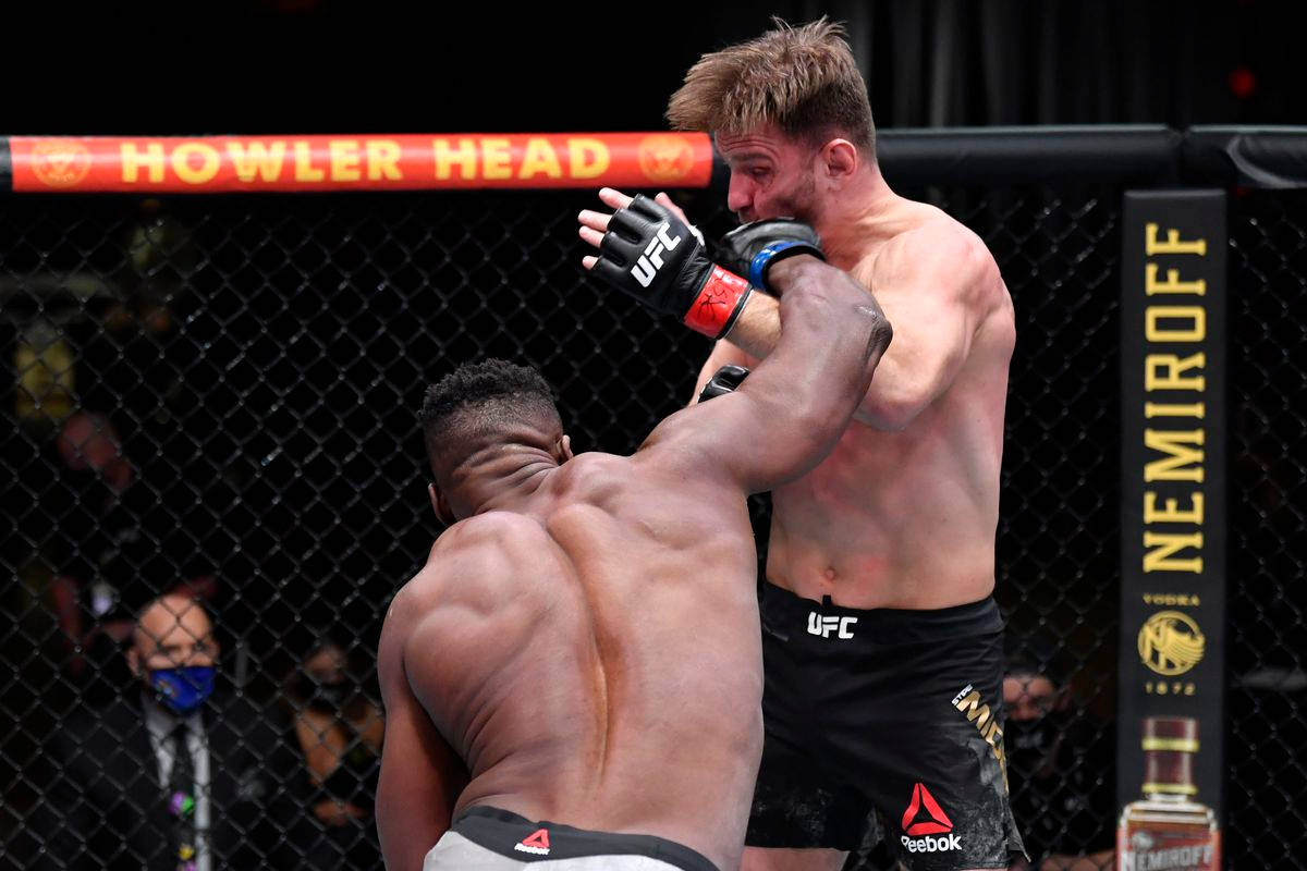 Stipe Miocic Punched By Ngannou Background