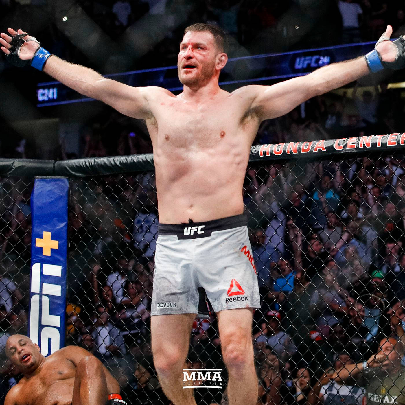 Stipe Miocic With Defeated Opponent