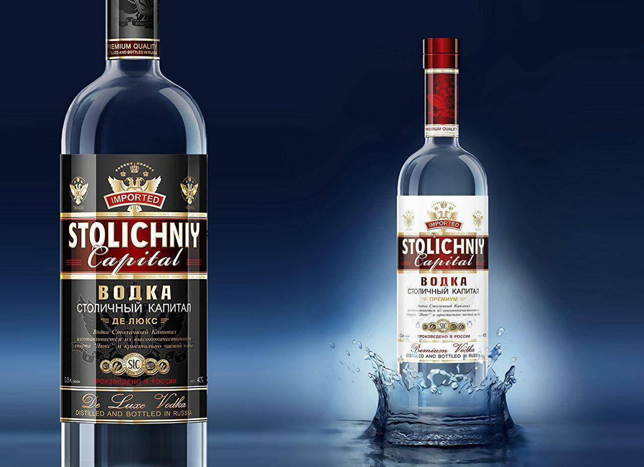 Stolichniy Vodka Bottles On Water Background