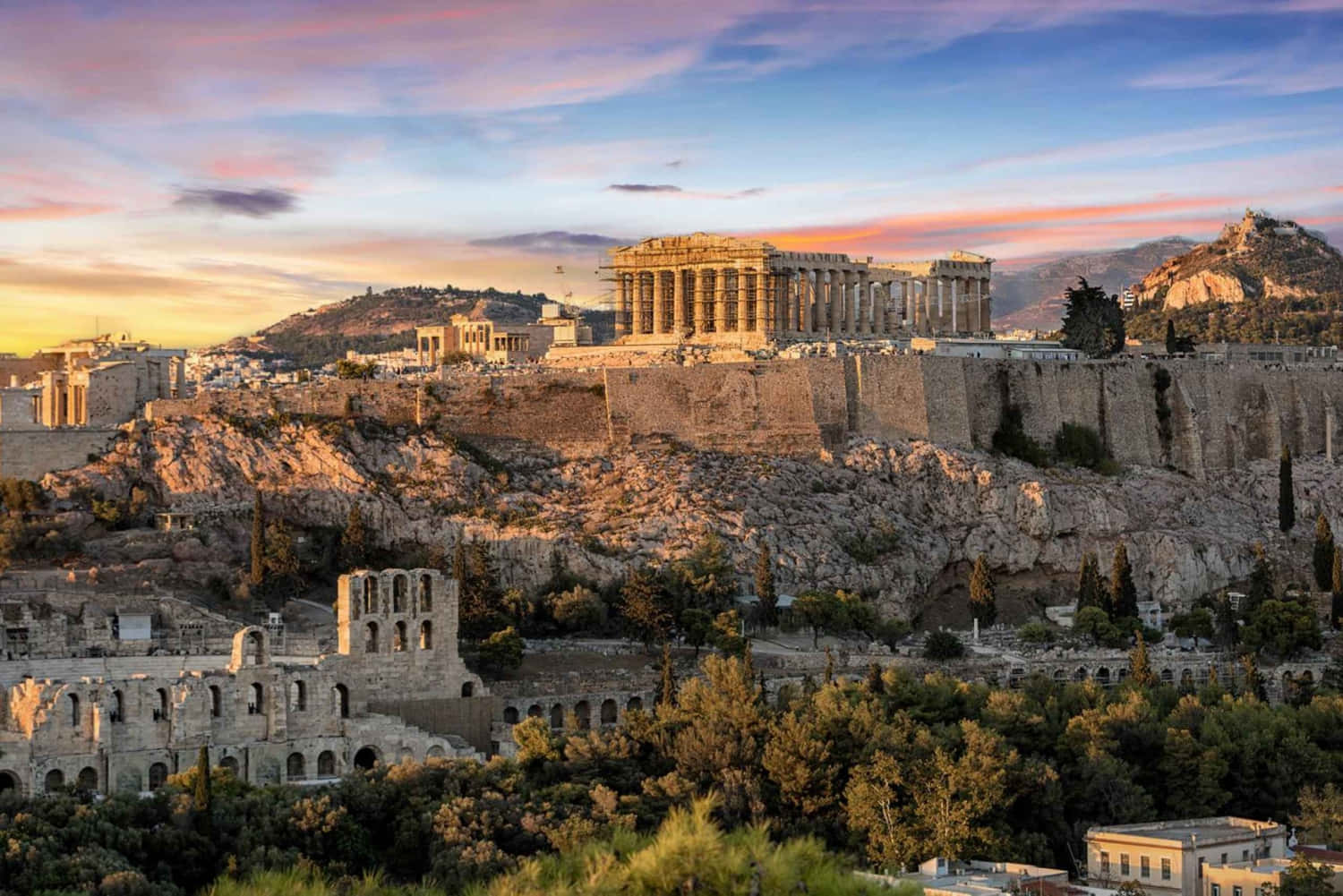 Stone Buildings In Sounion Background