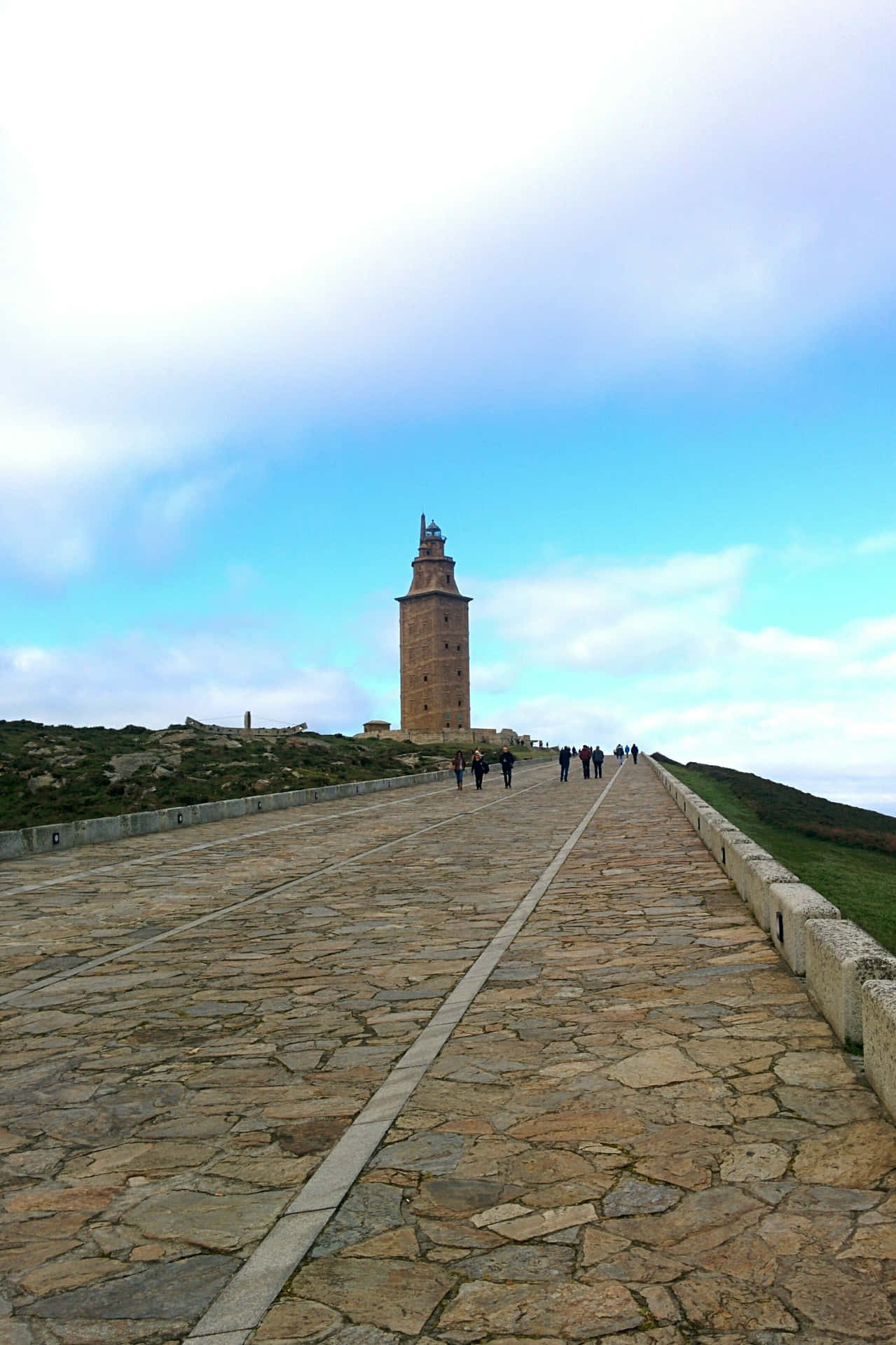 Stone Road Leading To The Tower Of Hercules Background