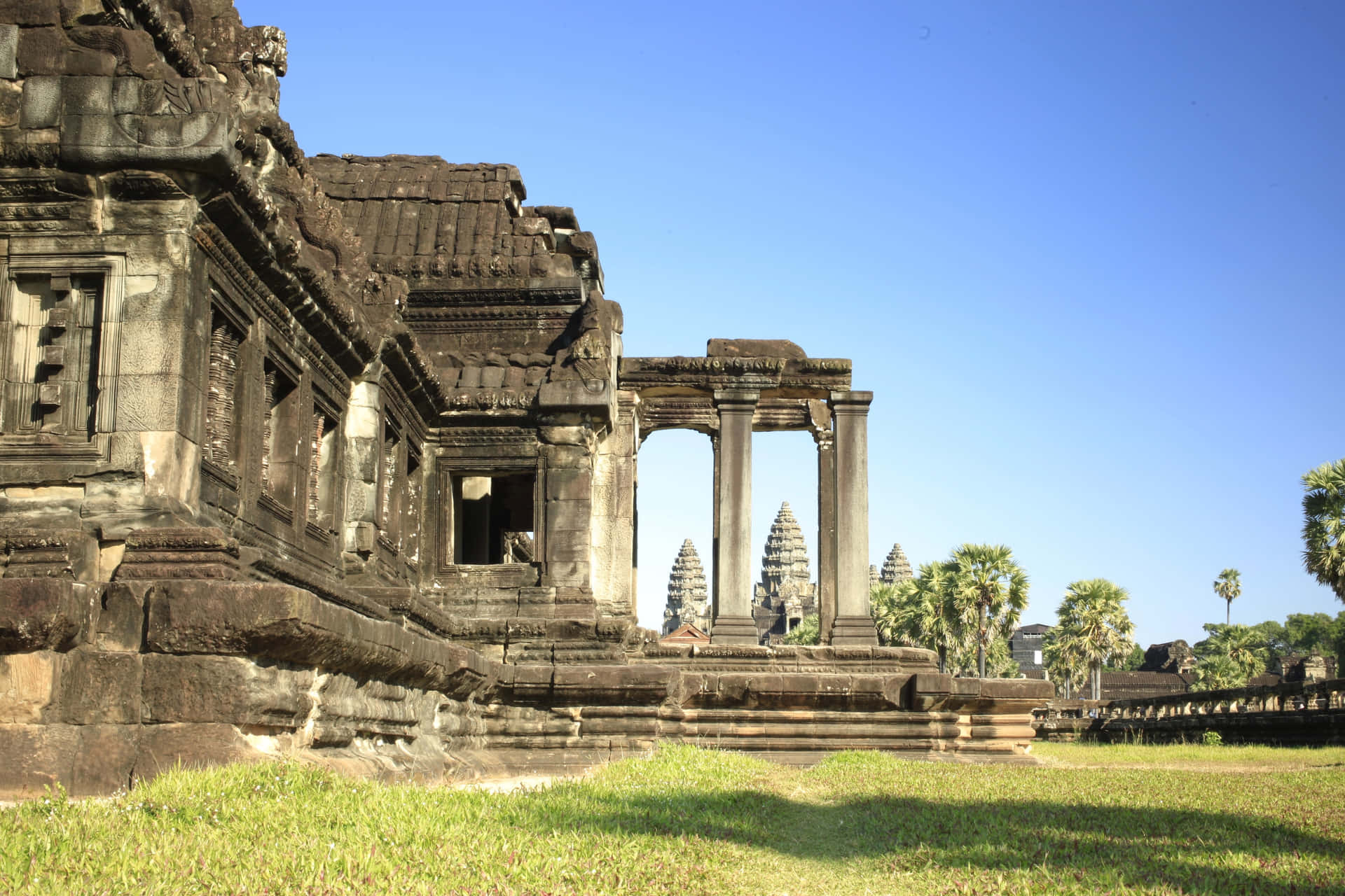 Stone Ruins Of Angkor Thom Sunny Background