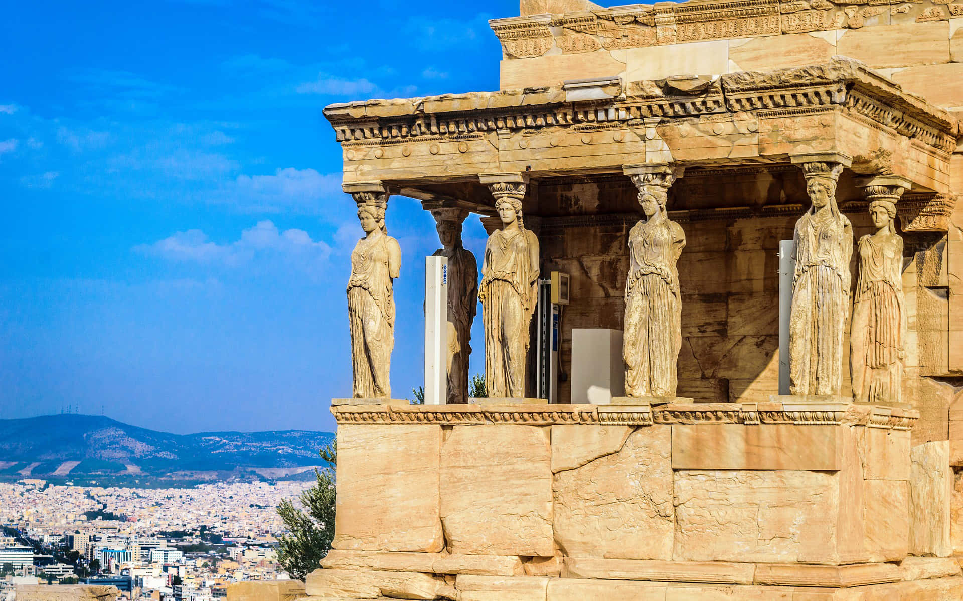 Stone Statues In Cape Sounion Background