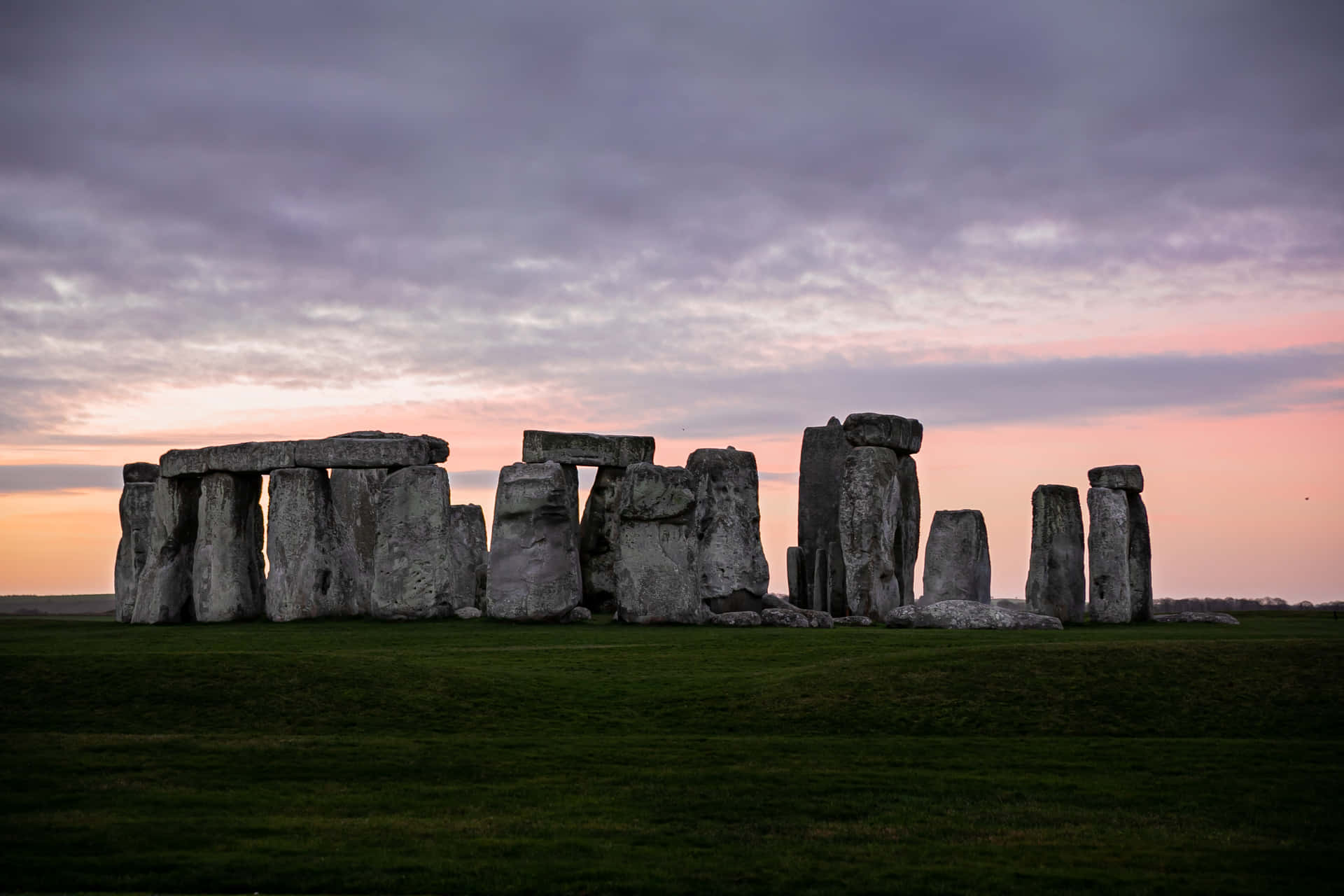 Stonehenge Under The Pastel Purple Clouds Background