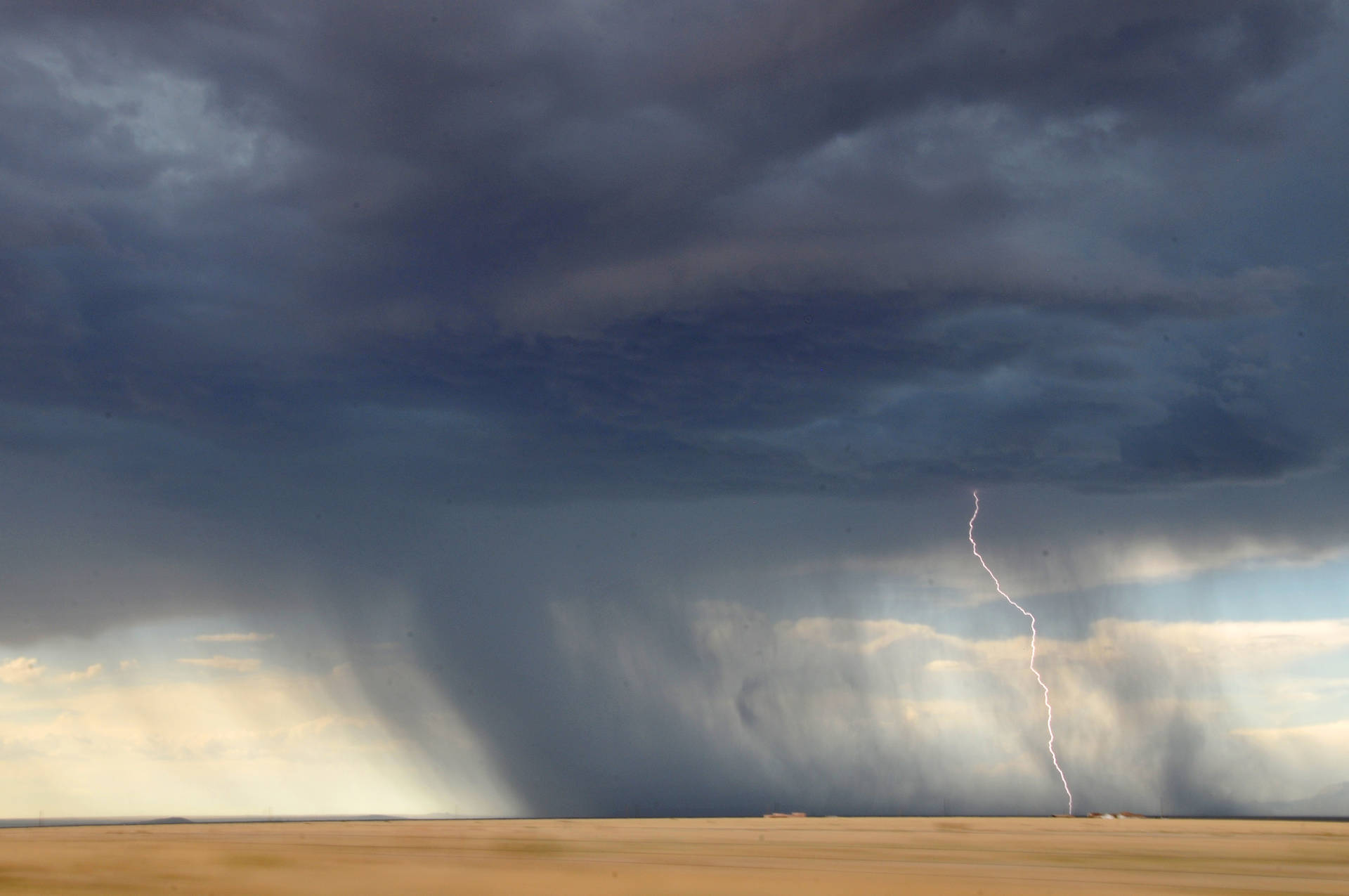 Storm Lightning Strikes At Desert Background