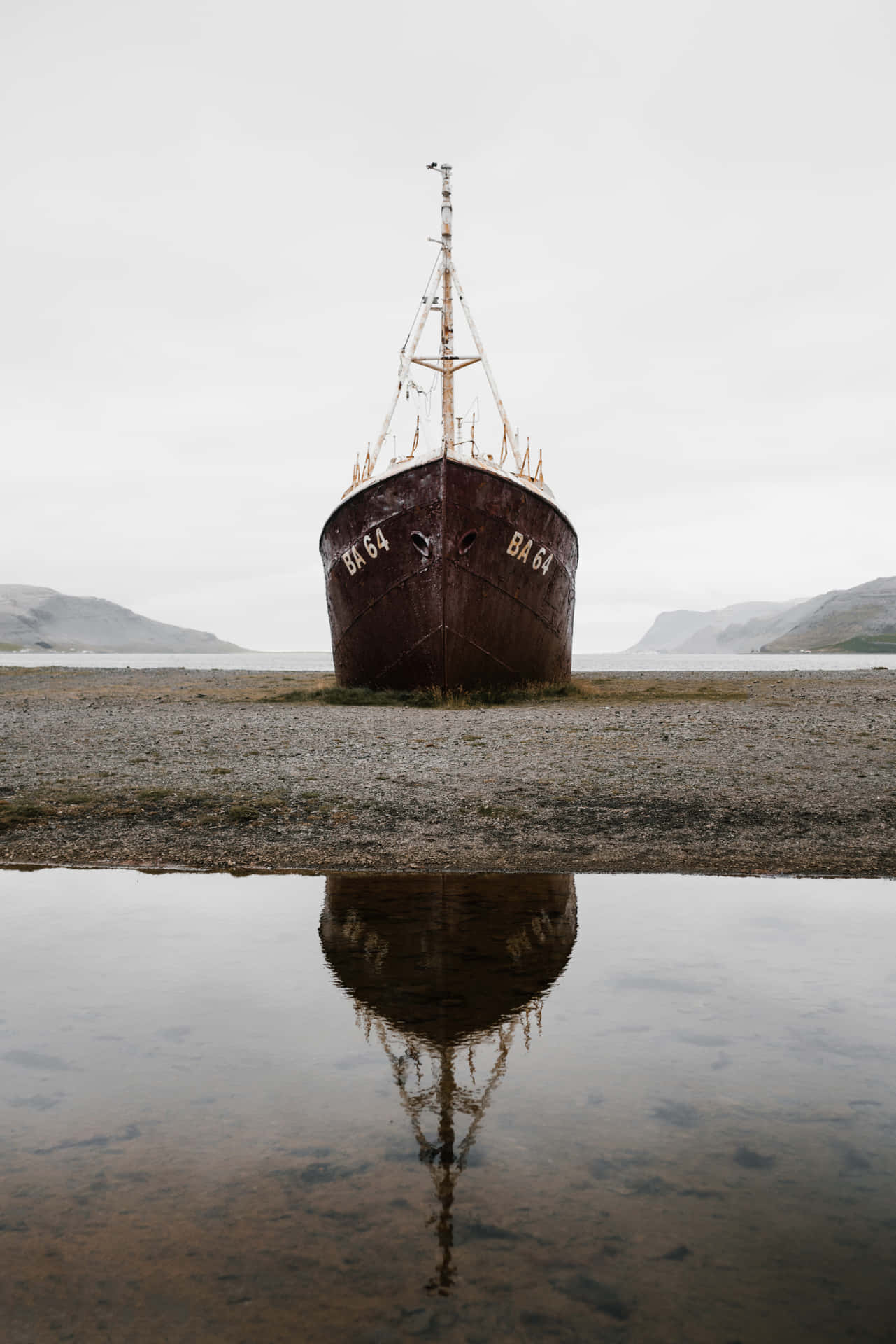 Stranded Boat And Its Reflection