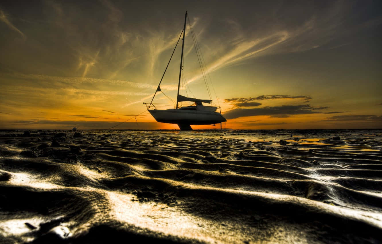 Stranded Boat At Low Tide Background