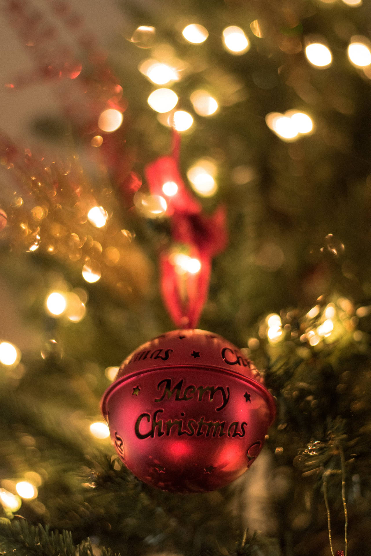 Strands Of Colorful Lights Illuminating A Snowy Christmas Scene Background