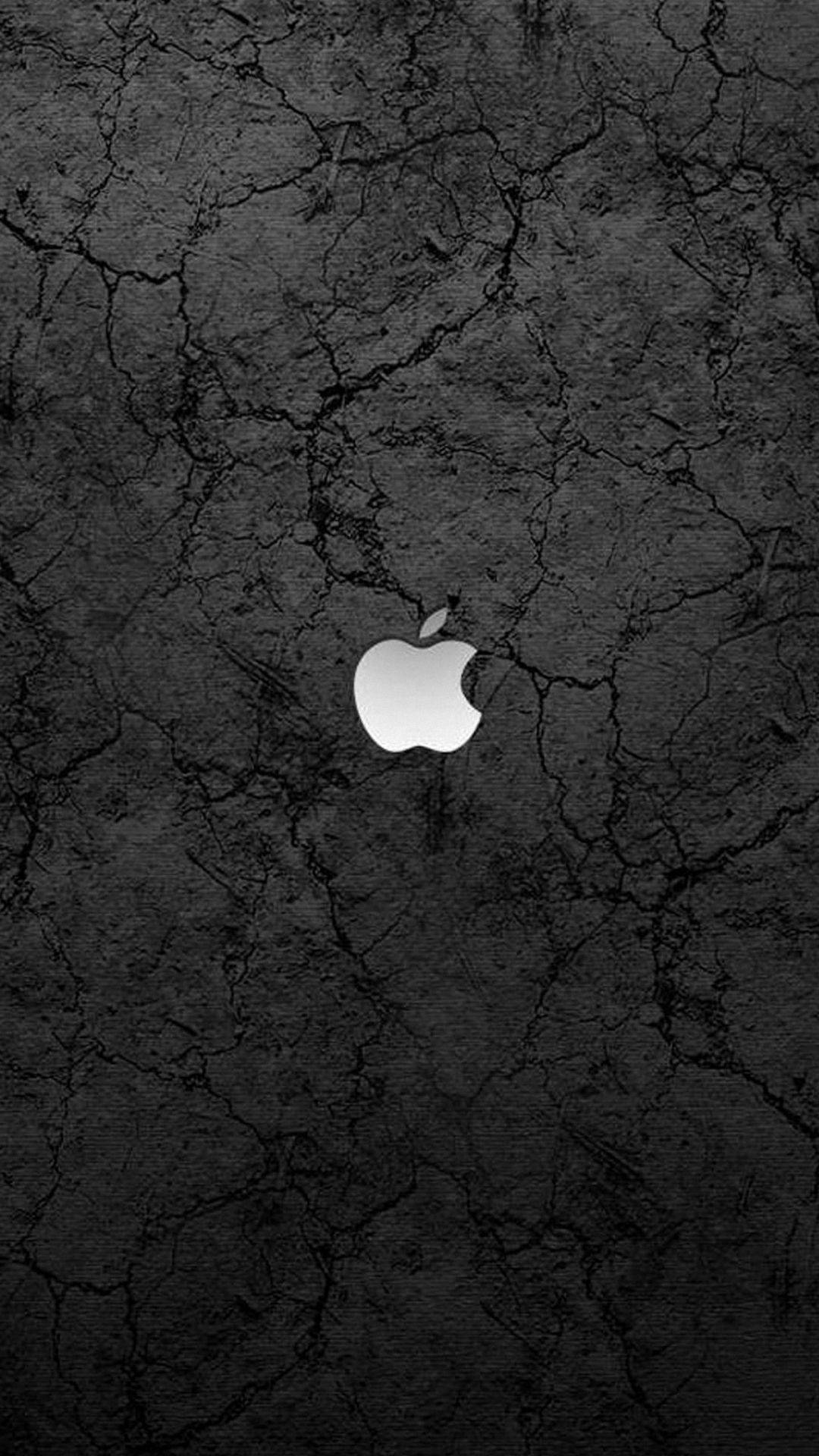 Strategically Placed Apple Logo Against A Cracked Concrete Backdrop. Background