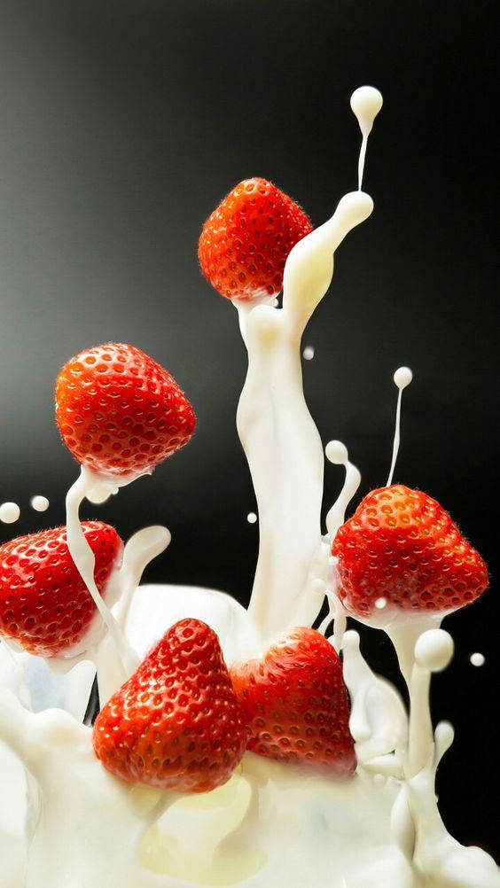 Strawberries In Milk Background