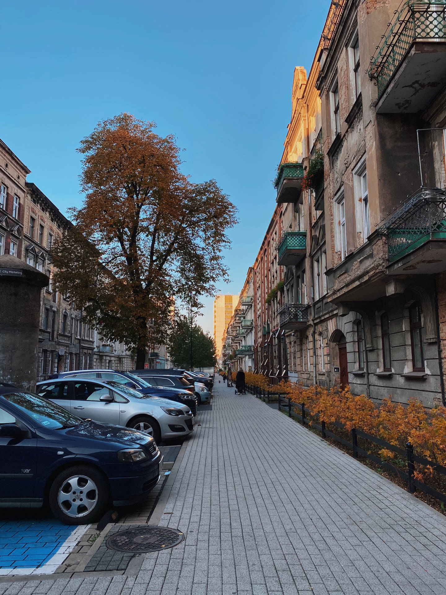 Street With Buildings And Parking Lot Background