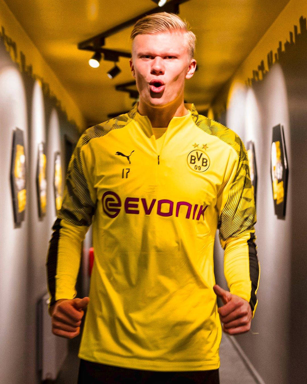 Striker Haaland Wearing Yellow Bvb Jersey Background