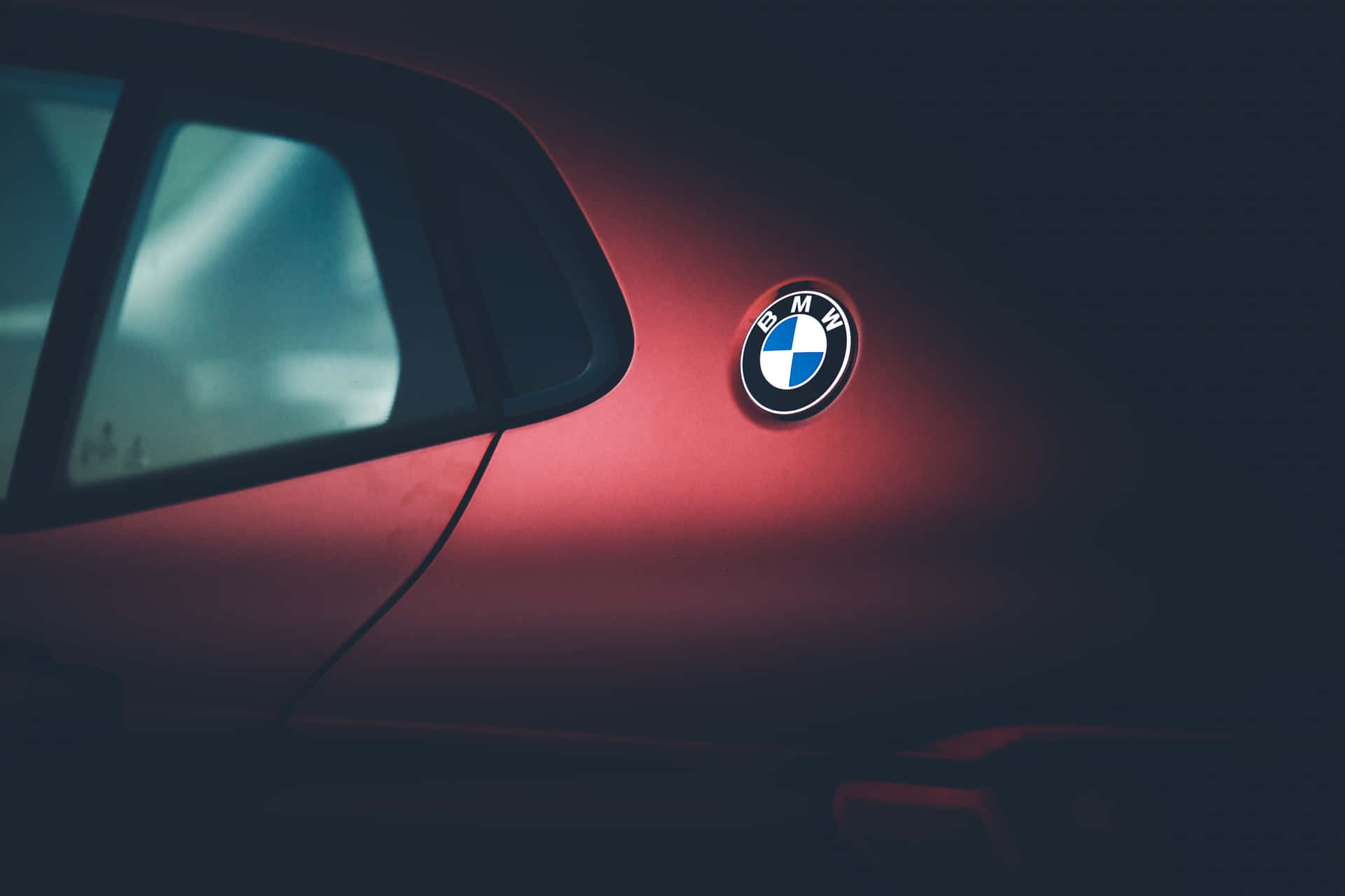 Striking Logo Of Bmw On A Dark Background Background