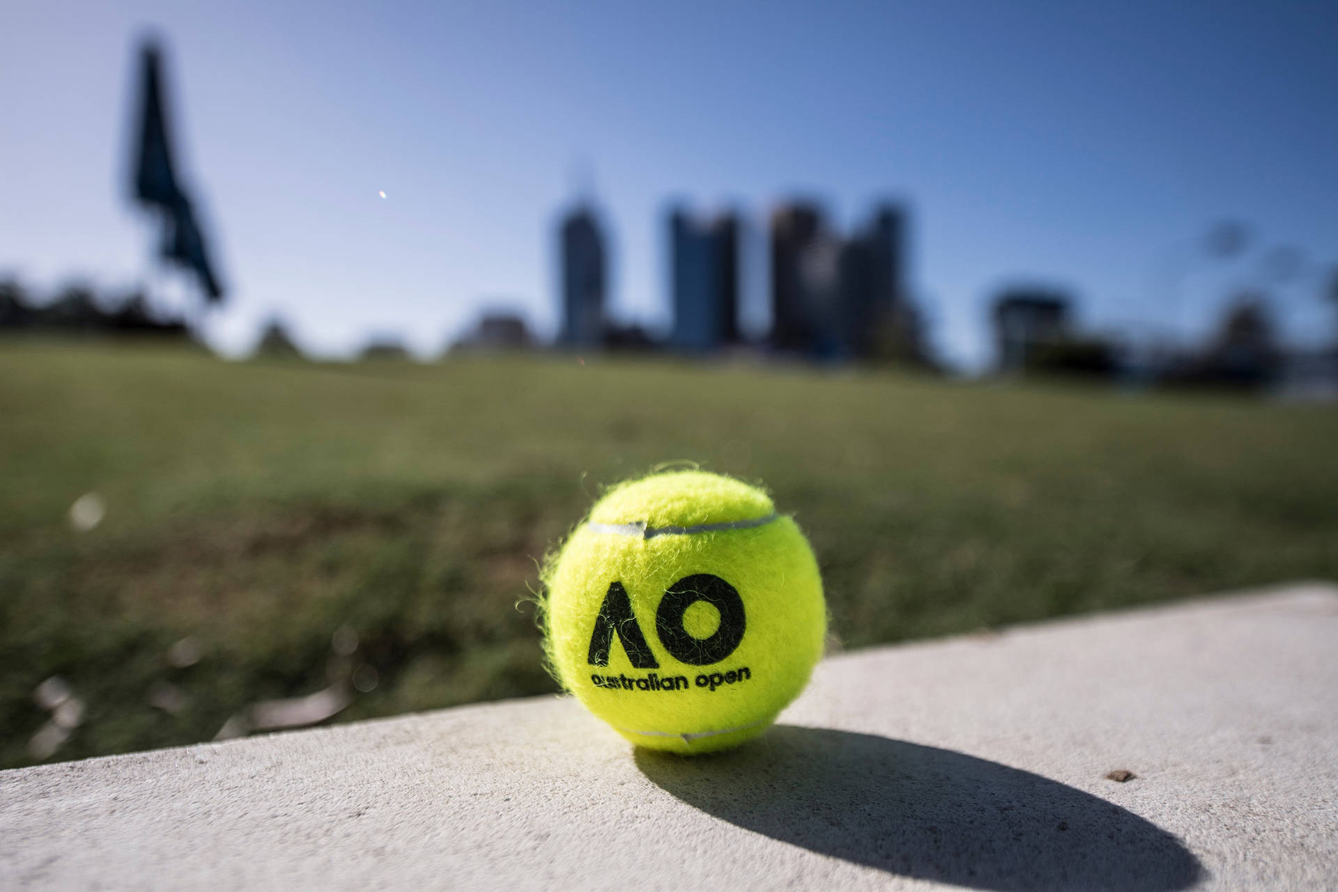 Striking Neon Green Tennis Ball At The Australian Open Background