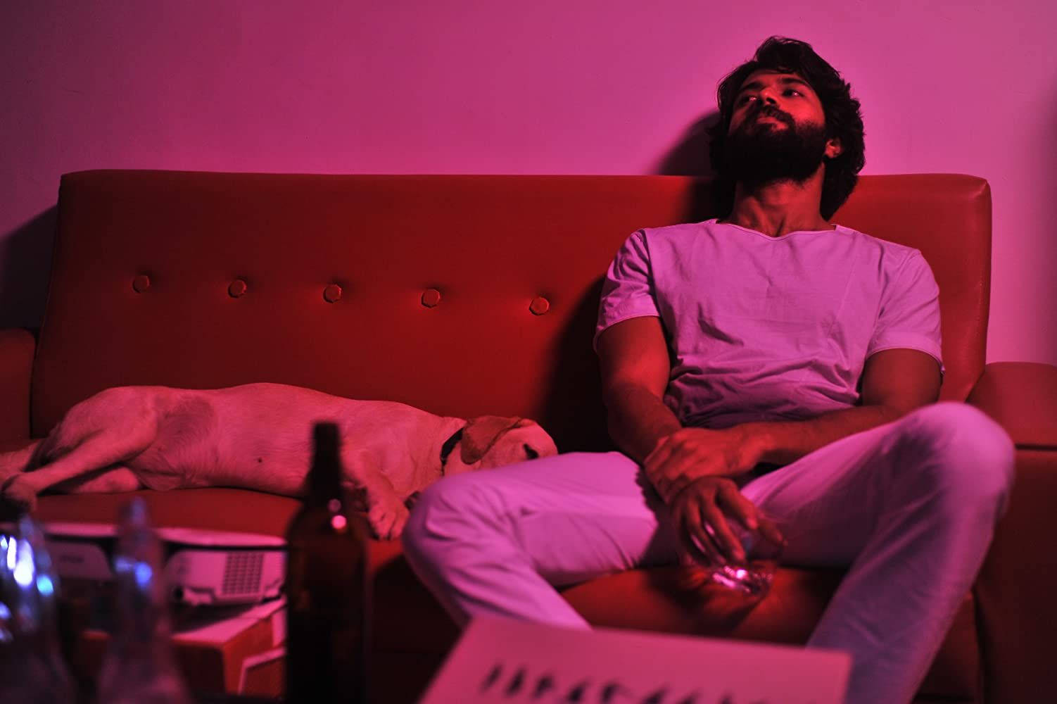 Striking Portrait Of Arjun Reddy From The Acclaimed Movie, Illuminated In Pink Light Background