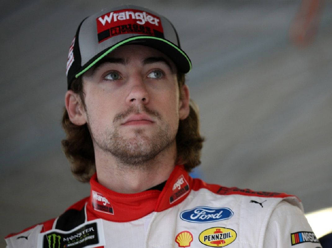 Striking Portrait Of Champion Race Car Driver Ryan Blaney Background