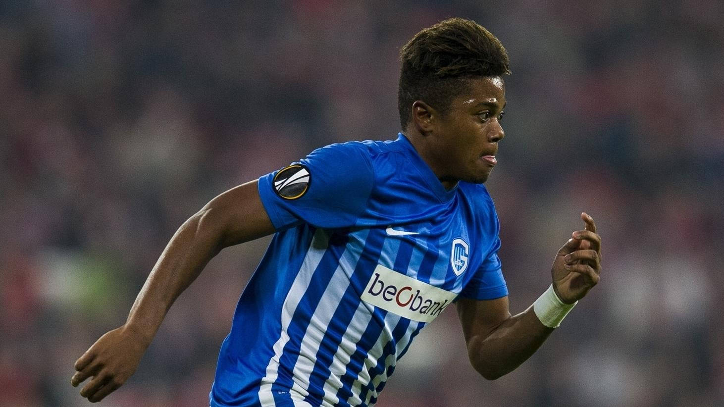 Striking Pose Of Leon Bailey, Professional Footballer, In A Blue Striped Jersey.