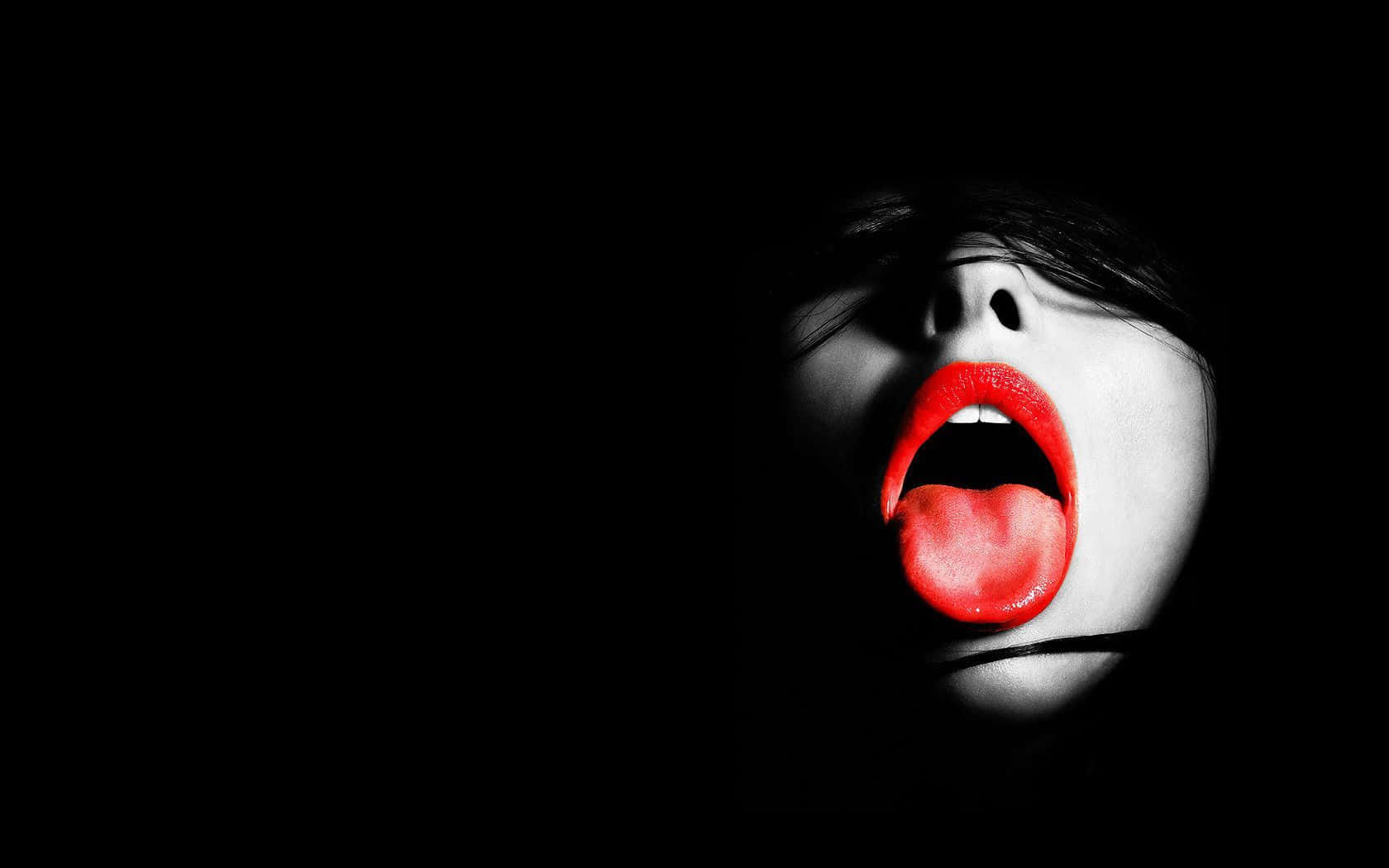 Striking Red Lips On A Dark Background Background