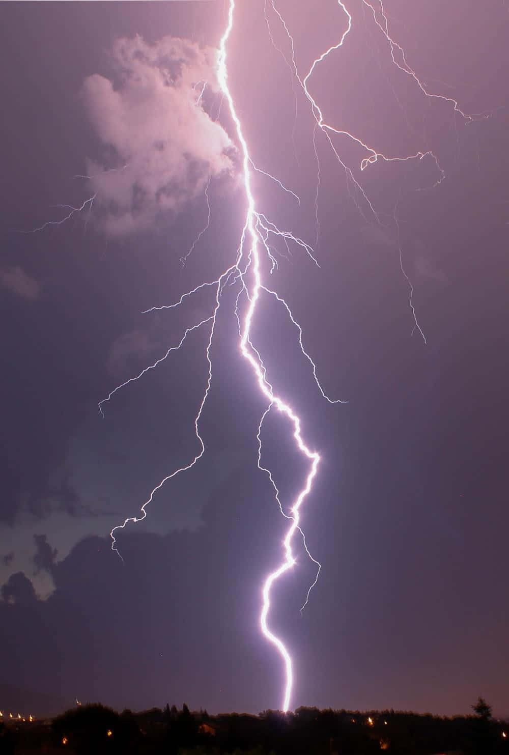 Strikingly Cool Lightning Strikes Over A Clear Night Sky Background