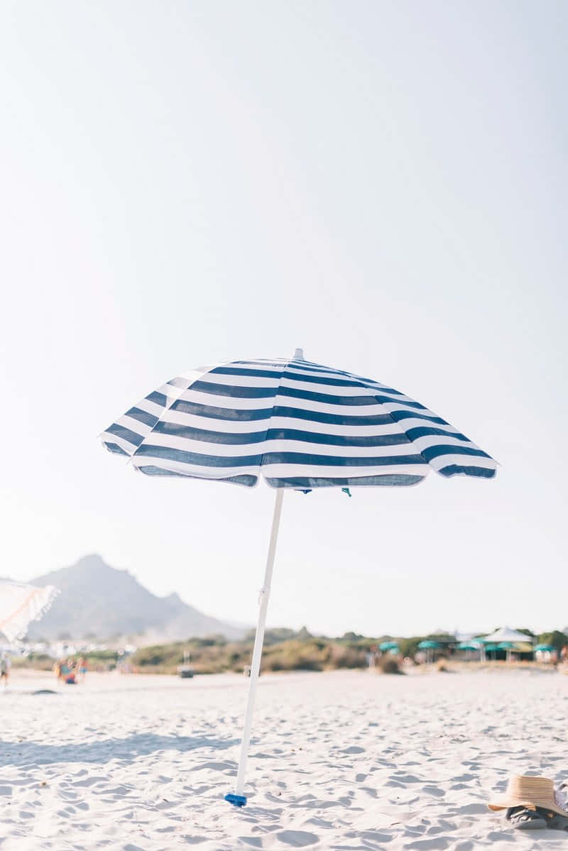 Striped Beach Umbrella Sandy Shoreline