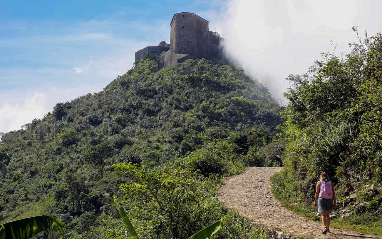 Strolling Across The Ancient Citadelle Laferriere Atop The Mountain In Haiti Background