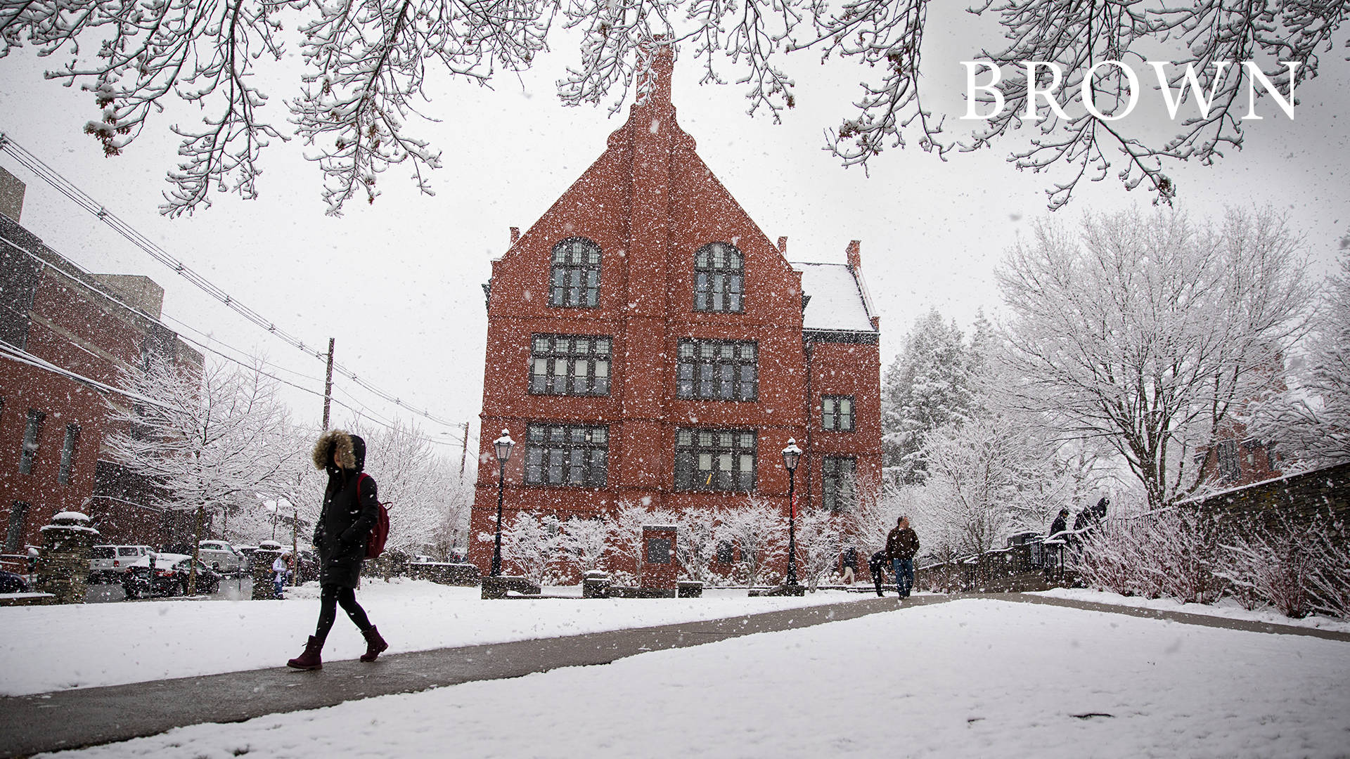 Student Walking At Brown University During Winter Background