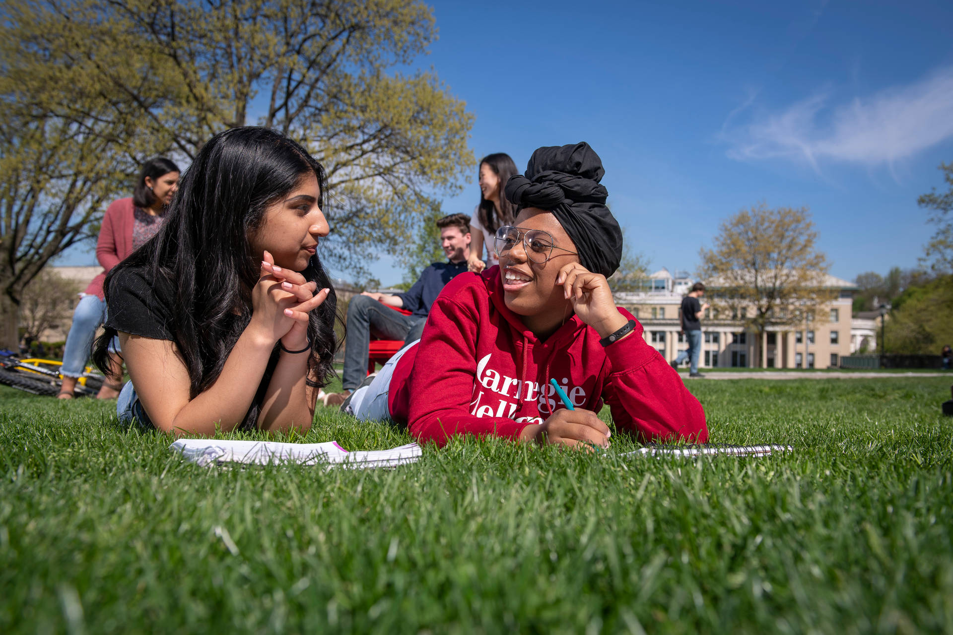 Students Lying On Grass Carnegie Mellon University Background