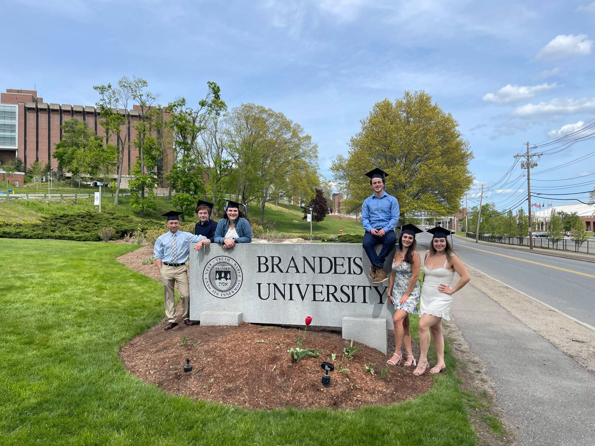 Students On Brandeis University Signage